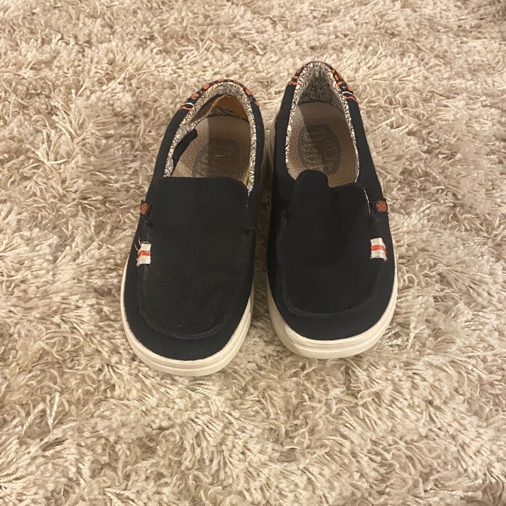 Women’s Hey Dude Black Slip-On Shoes with Orange accents